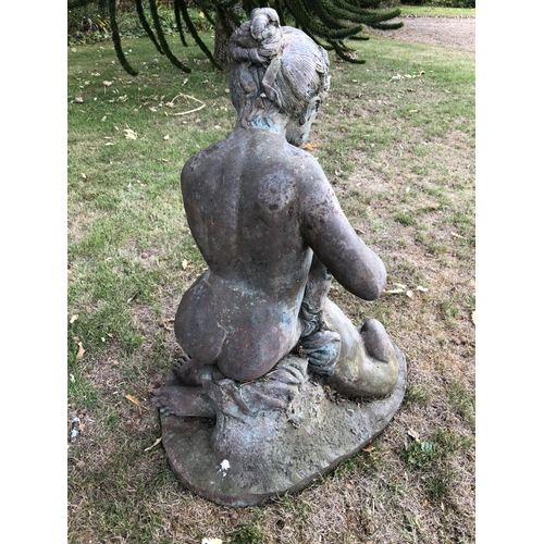 266 - A hollow cast bronze garden statue of a lady feeding a spaniel dog 80cm high