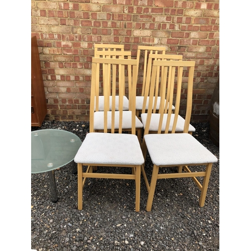 287 - A set of six modern dining chairs together with a modern glass coffee table