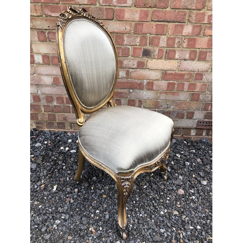 290 - A French gold gilt chair raised on castors