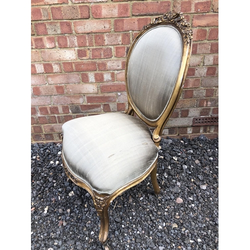 290 - A French gold gilt chair raised on castors