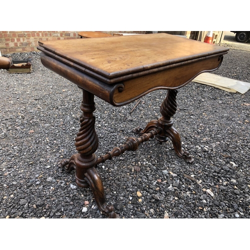 298 - A Victorian rosewood games table (top loose)