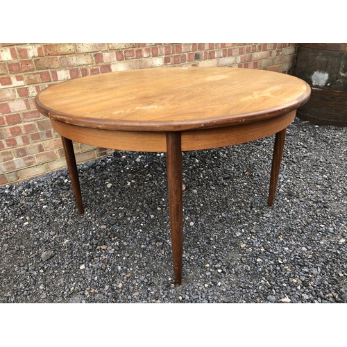 299 - A g Plan circular teak dining table with extension leaf