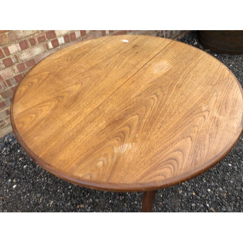 299 - A g Plan circular teak dining table with extension leaf