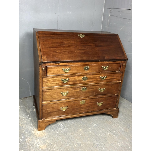 323 - A Victorian mahogany bureau with a fitted interior above four drawers 92x50x98