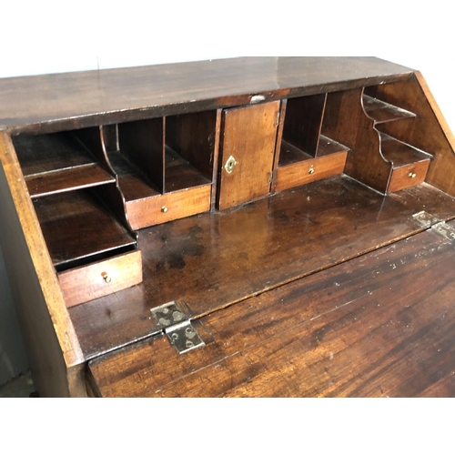 323 - A Victorian mahogany bureau with a fitted interior above four drawers 92x50x98