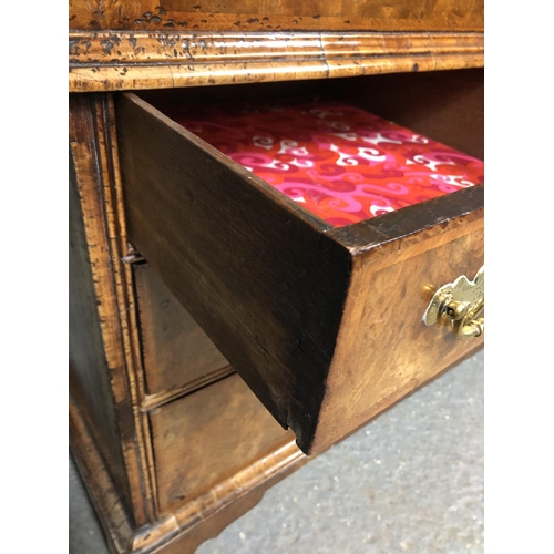 325 - A Georgian walnut bureau with a drop down front with a fitted interior above two short and two long ... 