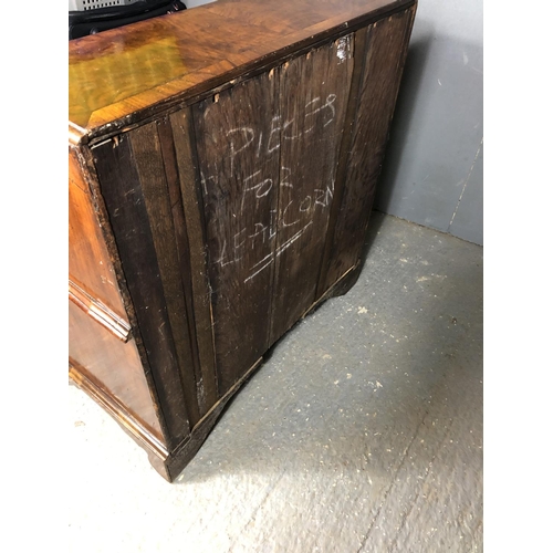 325 - A Georgian walnut bureau with a drop down front with a fitted interior above two short and two long ... 