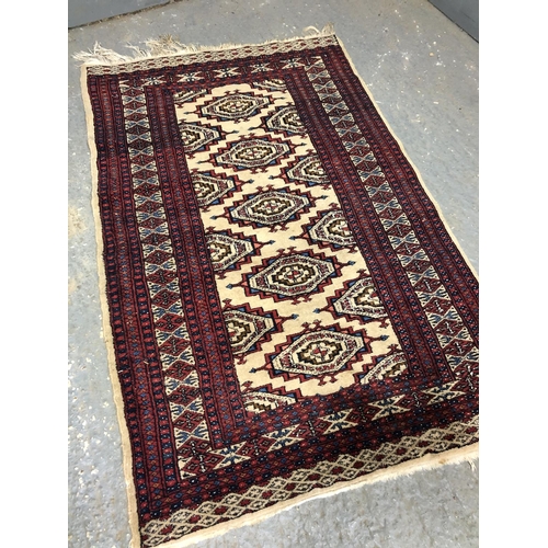 334 - A red Persian patterned rug 81x124