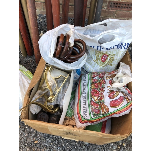 34 - An assortment of curtain poles and a box of rings and fittings