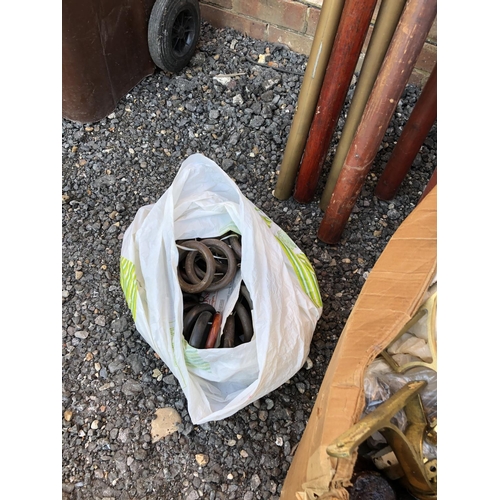 34 - An assortment of curtain poles and a box of rings and fittings