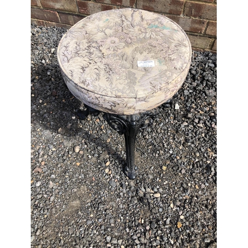 355 - A cast iron stool with upholstered seat