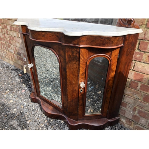 362 - A Victorian walnut credenza with mirror panel doors and a mirror back