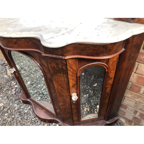 362 - A Victorian walnut credenza with mirror panel doors and a mirror back