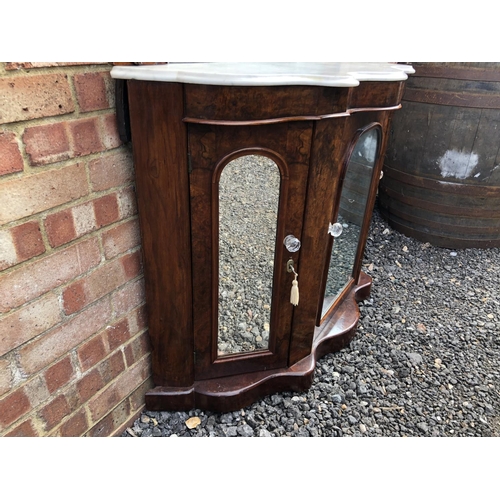 362 - A Victorian walnut credenza with mirror panel doors and a mirror back