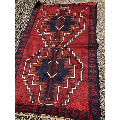 373 - A red and blue oriental Patterned rug 140x88