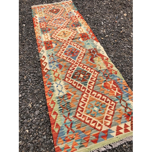 377 - A brightly coloured Chobi Kilim runner 192x60