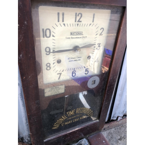 383 - An original 'clocking in clock' manufactured by the National time recorder co. 100cm high (woodworm ... 