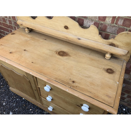 4 - A country pine sideboard with three drawers and and single cupboard 120x52x82