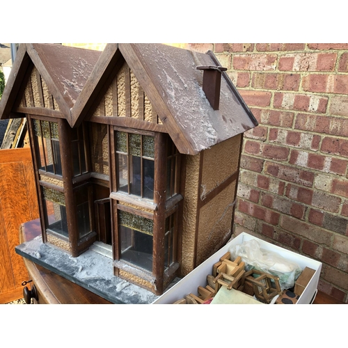 40 - A early 1940's hand built illuminating model house together with a box of furniture