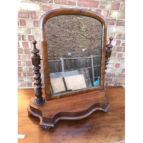 44 - A mahogany swing mirror