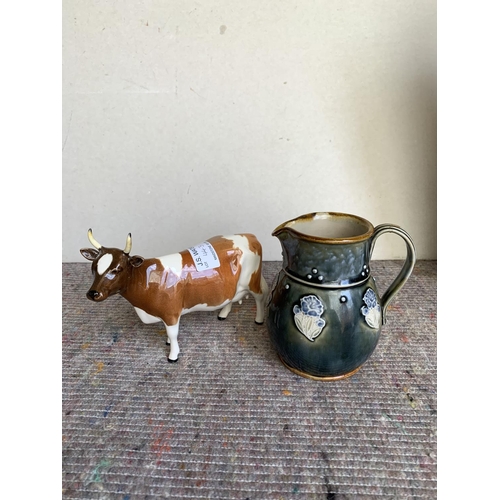 443 - Beswick cow figure together with small Doulton jug 11cm tall