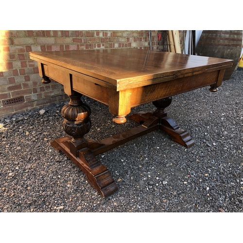 50 - An early 20th century large oak drawer leaf table 118x108cm