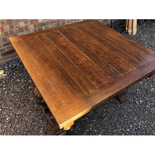 50 - An early 20th century large oak drawer leaf table 118x108cm