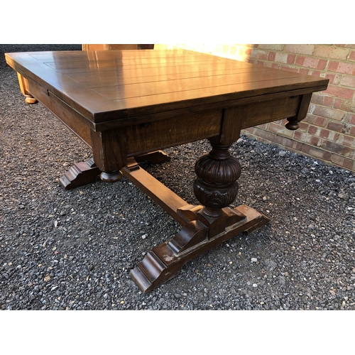 50 - An early 20th century large oak drawer leaf table 118x108cm