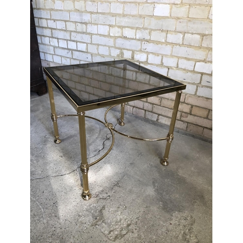 66 - A brass coffee table with a smoked glass top