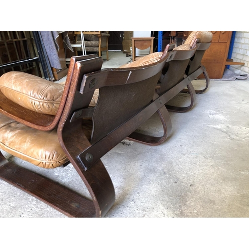 81 - A Swedish designer mid century couch with tan brown leather cushions