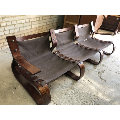 81 - A Swedish designer mid century couch with tan brown leather cushions