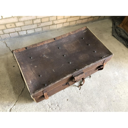 87 - A vintage brown travelling trunk