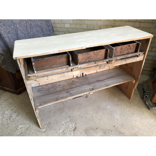 89 - A painted pine dresser base / counter with three drawers over two cupboard base 142x44x99