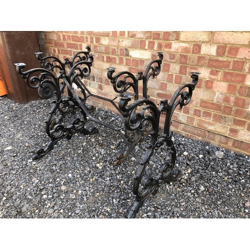 90 - Two black cast iron table bases