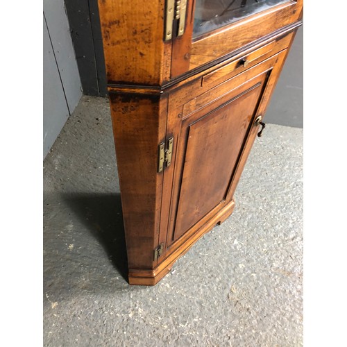 58 - A reproduction oak corner cabinet