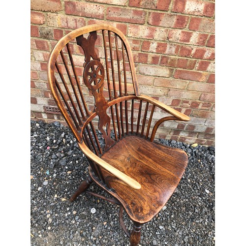 60 - A antique country Elm Stickback carver chair with crinoline stretcher