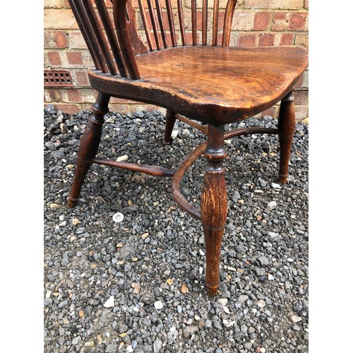 60 - A antique country Elm Stickback carver chair with crinoline stretcher