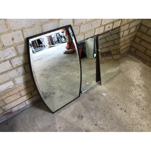 104 - An oak framed mirror together with two frameless mirrors