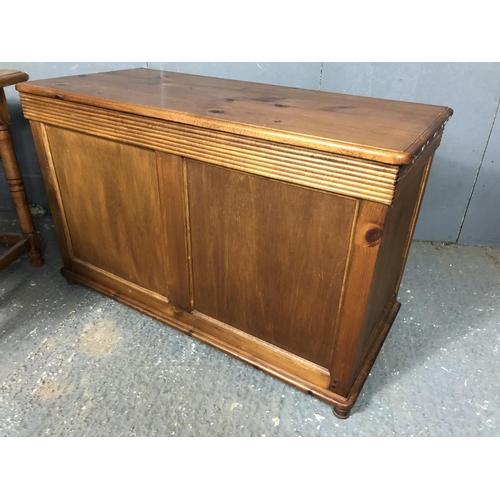 14 - A stained pine blanket box together with a stained pine occasional table