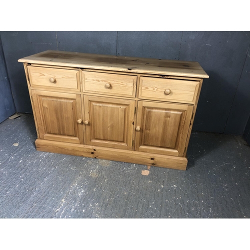 19 - A solid pine three drawer sideboard 131x43x80