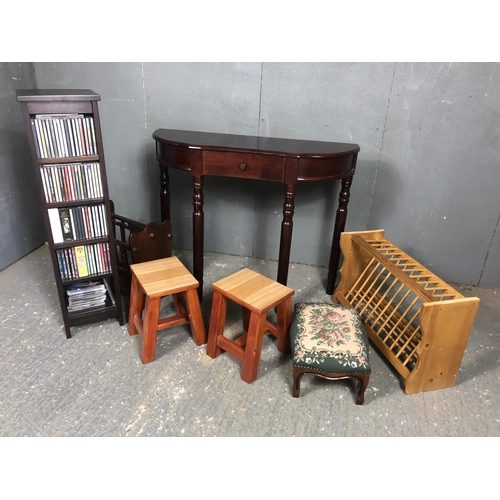 3 - A reproduction hall table together with three stools, magazine rack, cd rack and pine wall rack