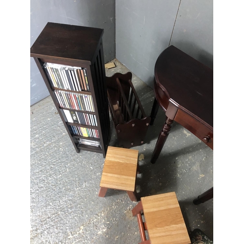 3 - A reproduction hall table together with three stools, magazine rack, cd rack and pine wall rack