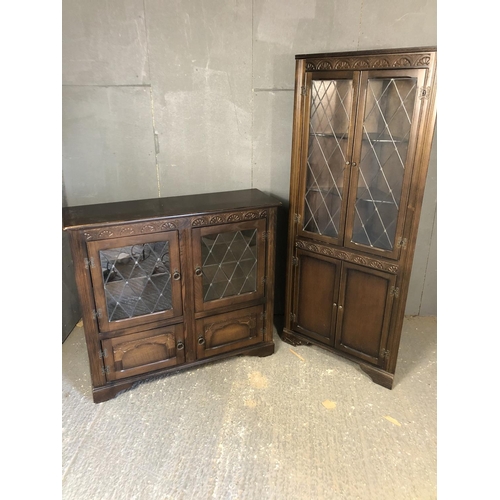 35 - A leaded oak display cabinet together with a matching corner cabinet