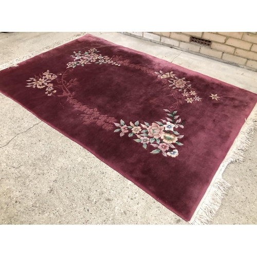 56 - A large pink Chinese style carpet 130x207