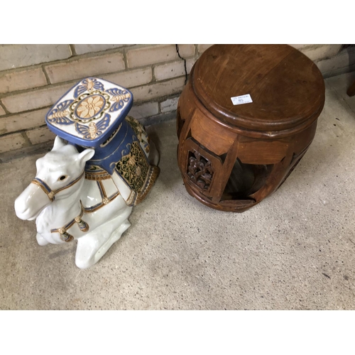 80 - A hardwood Oriental stool together with a ceramic camel stool