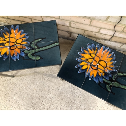 81 - A pair of mid century tile top tables