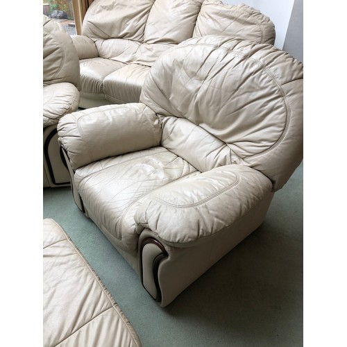 38 - A white leather five piece leather lounge suite, comprising a sofa, two armchairs, and two footstool... 