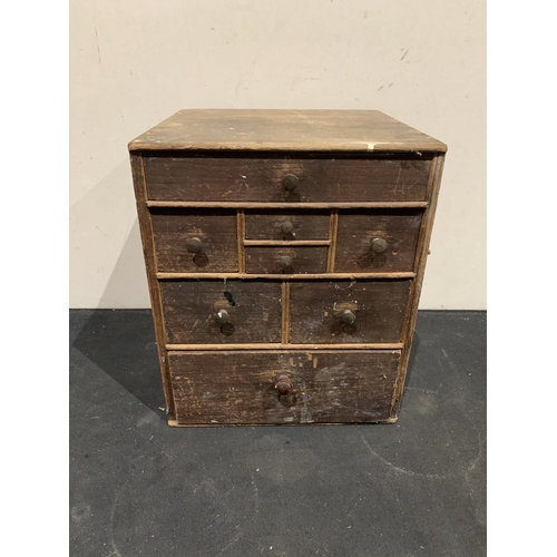 537 - Small wooden nest of 8 drawers, height 34cm
