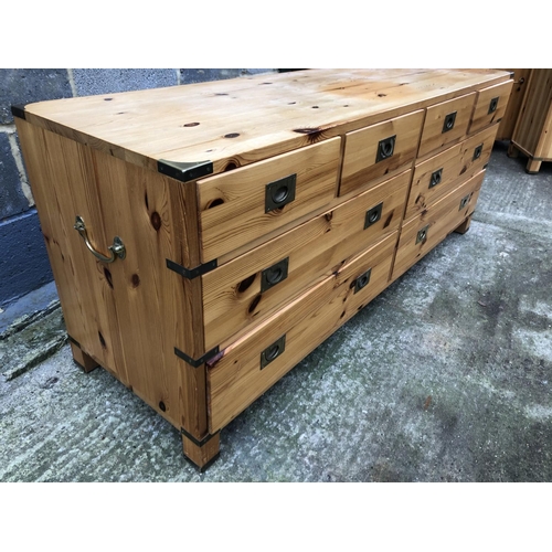 50 - A military style pine chest of eight drawers 150 x 46 x 61cm