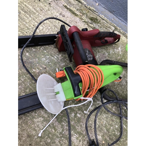 61 - An electric garden shedder, electric hedge cutter and electric chain saw